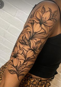 a woman's arm with flowers on it