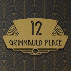 a sign that reads 12 grummuld place on the side of a wall