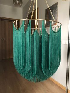 a green chandelier hanging from the ceiling