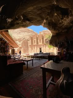 a living room filled with furniture next to a cave