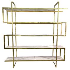 a gold shelf with marble shelves on it