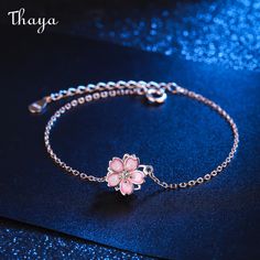 The Silver Cherry Blossom Bracelet embodies the beauty and fleeting nature of life, with delicate silver petals representing the fragility of existence. The cherry blossom holds deep symbolism in Japanese culture, representing renewal, hope, and the fleeting nature of beauty. Wear this stunning piece as a reminder to cherish life's precious moments and celebrate the temporary beauty of the world around us.   - Brand: Thaya  - Material: 925 Silver  - Size: 16+4 cm  - Weight: 2.14g  - Shape: Petals  - Gender: Women's Pink Girly Things Accessories, Cherry Blossom Bracelet, Cherry Blossom Jewelry, Simplistic Jewelry, Stylish Jewelry Accessories, Blossom Bracelet, Japanese Jewelry, Pretty Jewelry Necklaces, Jewelry Accessories Ideas