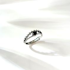 * This elegant ring features a delicate vine-like design with leaf-shaped accents, exuding a perfect blend of nature-inspired charm and timeless sophistication. * The centerpiece black zircon, surrounded by intricate details, resembles a shimmering star in the night sky, adding a touch of mystery and refined beauty. * Band Width: 6mm * 100% Nickel and Lead Free * They are tarnish resistant but please keep in a sealed plastic bag when not wearing. * A perfect gift for birthday, anniversary, graduation,  party, friends, mother, woman, men. * The jewelry comes in a delicate gift box and a small gift.  * Please feel free to contact me for any questions. SHIPPING NOTE: ♥ Orders will be shipped on the second business day, and a tracking number will be provided.  ♥ Delivery usually takes 3-7 days Ivy Ring, Graduation Ring, Olive Leaf Ring, Graduation Rings, Obsidian Ring, Vine Ring, Black Gems, Detailed Jewelry, Olive Leaf