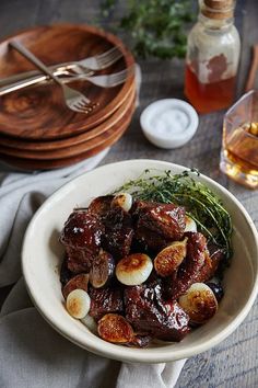 a white bowl filled with food on top of a table