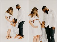 a couple and their two children are standing in front of a white wall with the baby's mom holding her belly