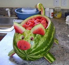 a watermelon carved to look like a pig