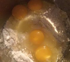 three eggs are being cooked in a pot