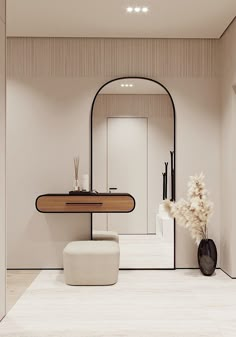 a bathroom with a mirror, stool and vase on the floor in front of it