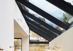 a bathroom with a skylight above the bathtub