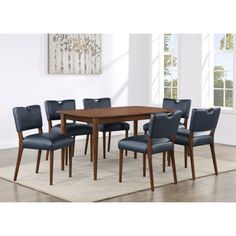 a dining room table with blue chairs around it