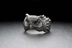 Owl Classic bird ring silver Experience the wit and beauty of the great nature with this stunning Owl Silver Ring! Featuring a unique and intricate design, made of 925 Sterling Silver in an oxidized finish, this eye-catching piece makes for the perfect accessory for any bird lover. Make this special gift for yourself or the birding enthusiast in your life - they'll love it! Dive into the deep with our nature-inspired design and benefit from the all-seeing eyes of our wise feathery companion! ∙ M Owl Rings, Silver Flask, Owl Wings, Owl Head, Bird Ring, Sterling Silver Owl, Owl Ring, Bird Rings, Animal Ring