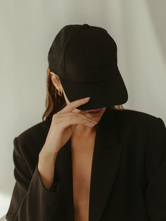 Our classic black on black six panel ball cap. Make a blazer casual cool, or active wear streetwear ready. Features a curved brim with adjustable strap and a black embroidered logo and label on the back. This item is a final sale.FORWARD BASICS10% of all sales benefit female forward charities giving back to women through the provision of resources and opportunities. DETAILS* Black Ball Cap with Black logo and label * One size, adjustable closure * Structured, 6-panel * Unisex FABRIC + CARESpot c Girls Wearing Caps, Cap For Girls Style, Ball Cap Outfit, Sporty Cap, Streetwear Photoshoot, Streetwear Hats, Black Caps, Plain Caps, Cap Outfit