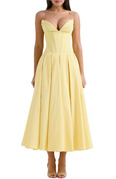 A buttery yellow gown is designed with the brand's signature boned bodice, a swishy, tulle-lined skirt and the perfection of a pair of discreet pockets. Exclusive retailer Hidden back-zip closure Strapless Plunge neck Side-seam pockets Lined 65% viscose, 35% polyester Dry clean Imported Champagne Bars, Strapless Long Dress, Voluminous Skirt, Backless Dress Summer, Strapless Summer Dress, Corset Gown, Yellow Gown, Tulle Midi Dress, Corset Midi Dress