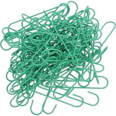 a pile of green paper clips sitting on top of each other