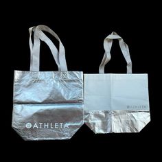 Athleta Lot Of 2/ Reusable Large Silver Metallic & White Tote Bag New Never Used Functional White Packable Bags, White Tote Gym Bag, White Sports Tote Bag, Rectangular White Gym Bag, White Sporty Shopping Bag, Sporty White Bag For Shopping, Sporty White Shopping Bag, Eco-friendly Packable White Bag, Eco-friendly White Packable Bag