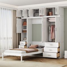 a white bed sitting next to a closet filled with lots of drawers and clothes on top of it