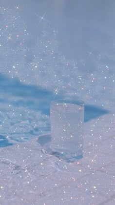 a square object floating in the middle of a body of water with bubbles on it