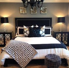 a black and white bed with pillows on it