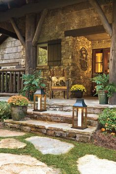 an outdoor porch with stone steps and potted plants