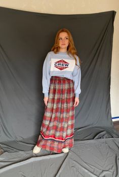 "beautiful red, cream, and blue handmade maxi skirt with ribbon detailing along the bottom; material is definitely thicker and has a texture, but is not itchy; fully lined with full zip and hook closure in the back; no tag or sizing but fits like a medium or women's size 6; for reference, model is 5\"5, 34B cup size, pear-shaped, and typically wears a medium women's size 6 in bottoms and this fits perfect! also hem length hits model right at the ankles! measurements: 13 1/2 inch waist, 19 inch h Skirt With Ribbon, Plaid Maxi Skirt, Caftan Dress, Henley Top, Corset Style, Retro Floral, Blazer Buttons, Cup Size, Waist Band