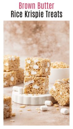 brown butter rice krispie treats stacked on top of each other with marshmallows