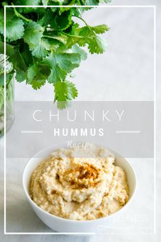 hummus in a bowl with parsley on the side