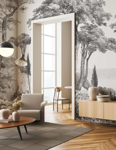 a living room filled with furniture and walls covered in wallpapered trees next to a window