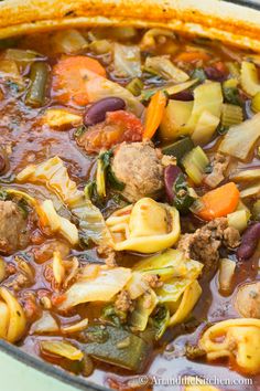 a pot filled with meat and vegetable soup