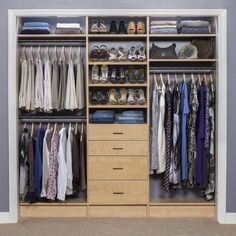 an organized closet with clothes and shoes