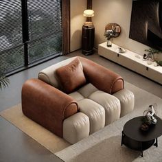 a living room filled with furniture and a flat screen tv on top of a wall