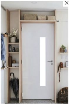 a white door in a room with shelving and baskets on the shelves next to it