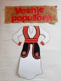 a paper cut out of a woman's dress with the words versie populiore above it