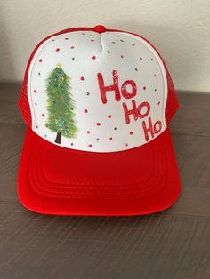 Christmas hand painted trucker hat!  Custom colors and designs available. Message me for info! Hand Painted Trucker Hats Diy, Handmade Fun Trucker Hat, Painted Trucker Hats, Casual Red Customizable Trucker Hat, Hand Painted Trucker Hats, Christmas Trucker Hat, Christmas Hand Painted, Painted Hats, Baby Painting