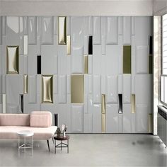 a living room filled with furniture and walls covered in metallic foiled squares on the wall