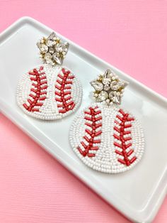 the baseball earrings are decorated with beads