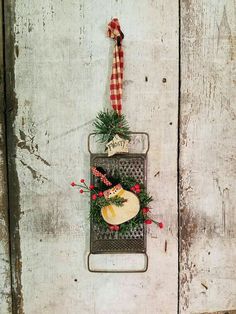 a christmas ornament hanging on the side of a door