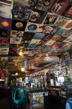 the ceiling is covered with posters and pictures