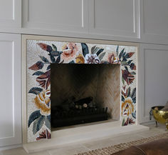 the fireplace is decorated with flowers and leaves