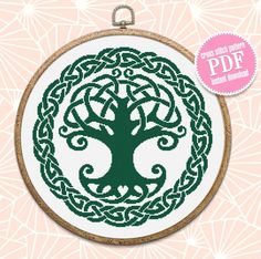 the celtic tree of life cross stitch pattern is shown in front of a pink background