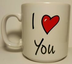 a white coffee mug with the words i love you written in black and red on it