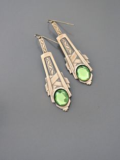 "Vintage Jewelry - Art Deco Inspired Earrings - Crystal Earrings - Bridal Earrings - Gold Earrings - Green Earrings - handmade Jewelry So gorgeous! Awesome Art Deco inspired earrings embellished with three sparkling green vintage crystals. Gold plated. Would be perfect for your wedding. Chloe says, \"Wear them and feel fabulous!\" They measure just over 2 1/2\" long. Thanks for visiting Chloe's" Art Deco Hallmarked Drop Earrings, Art Deco Jewelry As Gift, Art Deco Hallmarked Earrings As Gift, Art Deco Jewelry With Matching Earrings For Gifts, Art Deco Jewelry With Matching Earrings As Gift, Art Deco Sterling Silver Dangle Earrings, Elegant Handmade Green Linear Earrings, Art Deco Jewelry Set With Matching Earrings For Gifts, Art Deco Jewelry Set With Matching Earrings As Gift