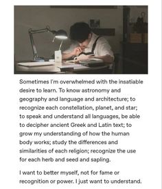 a person sitting at a desk with a book and pen in front of him, writing