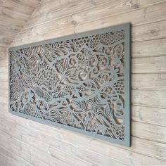 an intricately designed metal panel on the wall