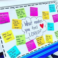 a bulletin board with post it notes attached to it that says what makes you feel loved?