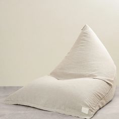 a large white pillow sitting on top of a floor