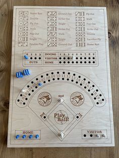 a wooden board game with dices and numbers on it