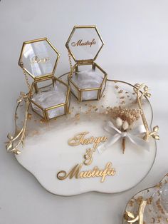 the wedding cake is decorated with gold and white frosting, which reads happy & marriage