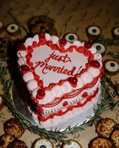 a heart shaped cake sitting on top of a table