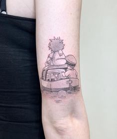 a woman's arm with a tattoo of a hedgehog on top of a car