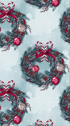 a christmas wreath with candy canes and ornaments on blue snowflakes fabric by the yard